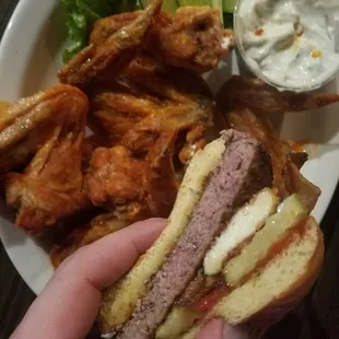 The 1/2 lb burger was on special. We added bacon and cheese curds for effect. The wing portion is huge for the price. Crispy and delicious!