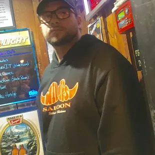 a man standing in front of a menu