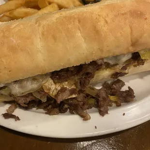 a steak sandwich and french fries