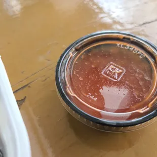 a cup of hot sauce
