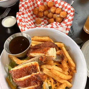 a plate of chicken and french fries