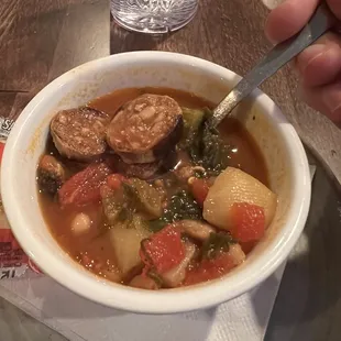 Kale and sausage soup in a tomato based sauce