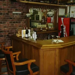 a bar with wine glasses on it