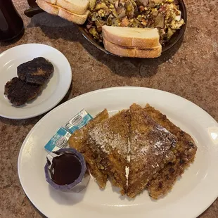 Crunchy French Toast with sausage patties (foreground) and the Meat lover's skillet