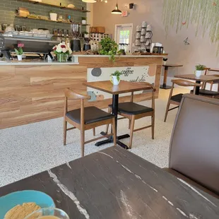 a table with a cup of coffee on it