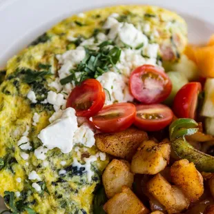 Greek Omelet with breakfast potatoes and fruit