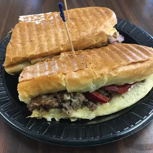 Philly cheesesteak with hot peppers.  Go for the hot peppers, it punches it up beautifully!