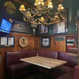 a booth with a table and benches