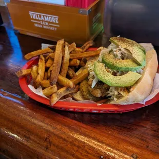 Fried Perch Po Boy with fries, avocado, slaw, pickles