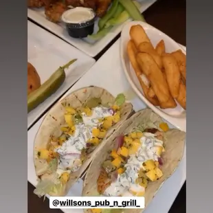 Fish tacos topped with mango sauce