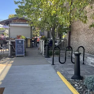 Outdoor patio seating (by bike rack)