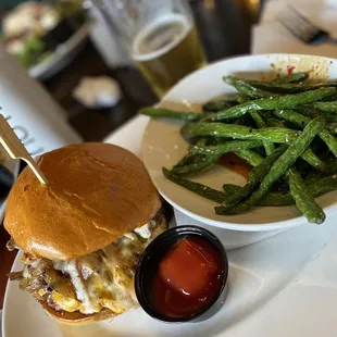 a burger and a side of green beans