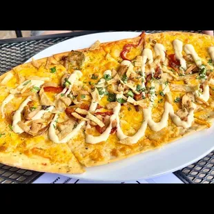  a flatbread pizza with cheese and toppings