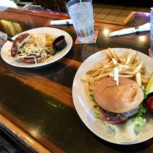 a hamburger and fries on a plate