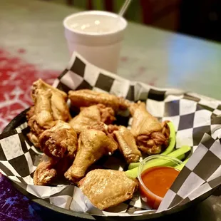 Naked, chicken, wings, reaper sauce on the side.