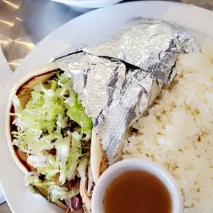 a burrito, rice and salad