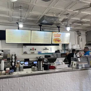 Front counter with modern digital menu.