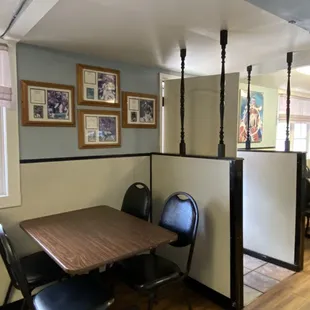 a dinning area with a table and chairs
