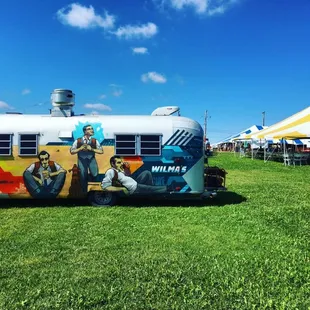 a food truck parked in a field