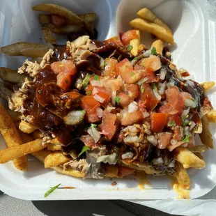 a plate of fries and a salad