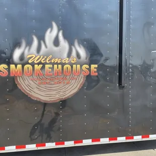 the logo on the side of the trailer