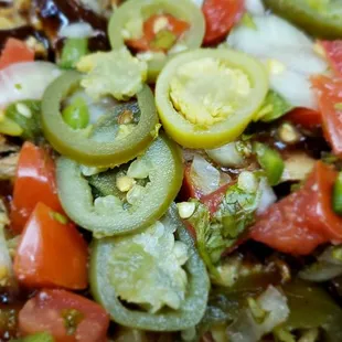 Up close, jerk chicken nachos.