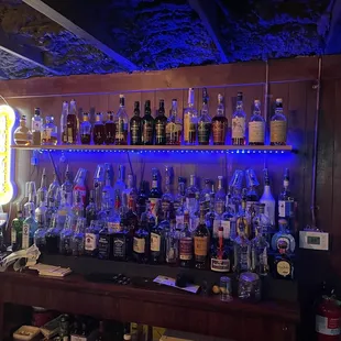 a bar with a lot of liquor bottles