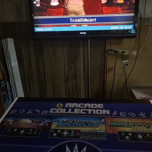 Multi game.. bowling, corn hole, and golden tee