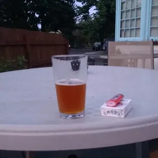 a glass of beer on a table