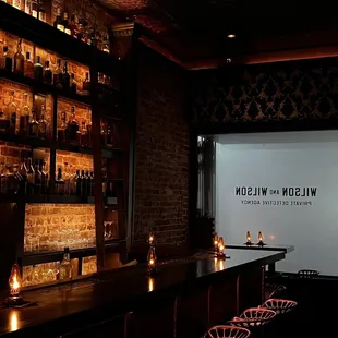 a bar with candles in front of it