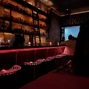 a bar with red lighting