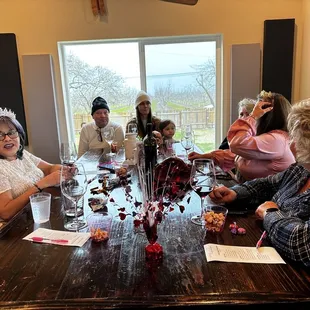 a group of people sitting around a table
