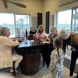 a group of people sitting around a table