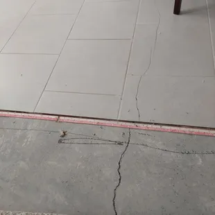 a crack in the floor of a kitchen