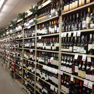 rows of wine bottles on shelves
