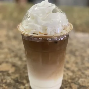 a cup of coffee with whipped cream