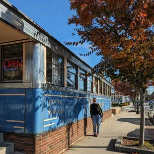 a man walking down the sidewalk