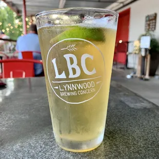 a glass of beer on a table