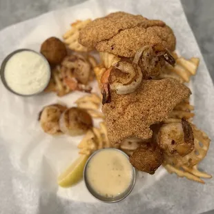 Fried catfish and grilled shrimp with waffle fries