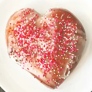 A most amazing cream filled, heart-shaped, sprinkled &amp; iced donut! Yum!