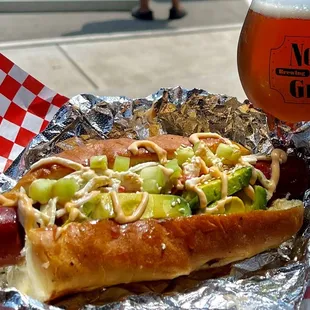 a glass of beer and a hot dog