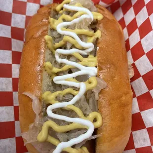 Munich dog. House Bratwurst, sauerkraut, German mustard, sour cream, creamy horseradish