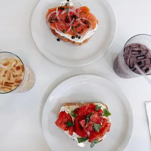 two plates of food on a white table