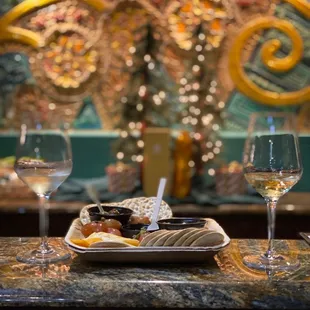 a plate of food and wine glasses