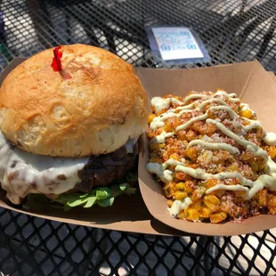 a cheeseburger and a side dish