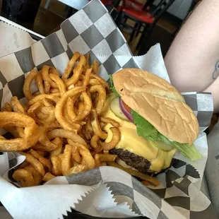 A whole pound burger with everything on it.