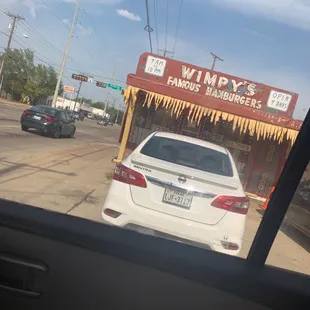 a car parked in front of a restaurant
