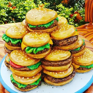 a stack of hamburgers on a plate