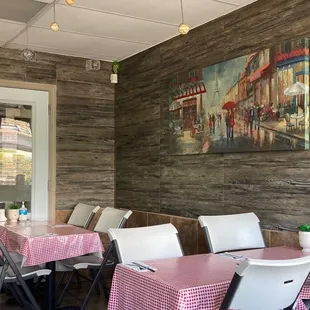 a dining room with tables and chairs