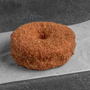 a donut on a piece of wax paper